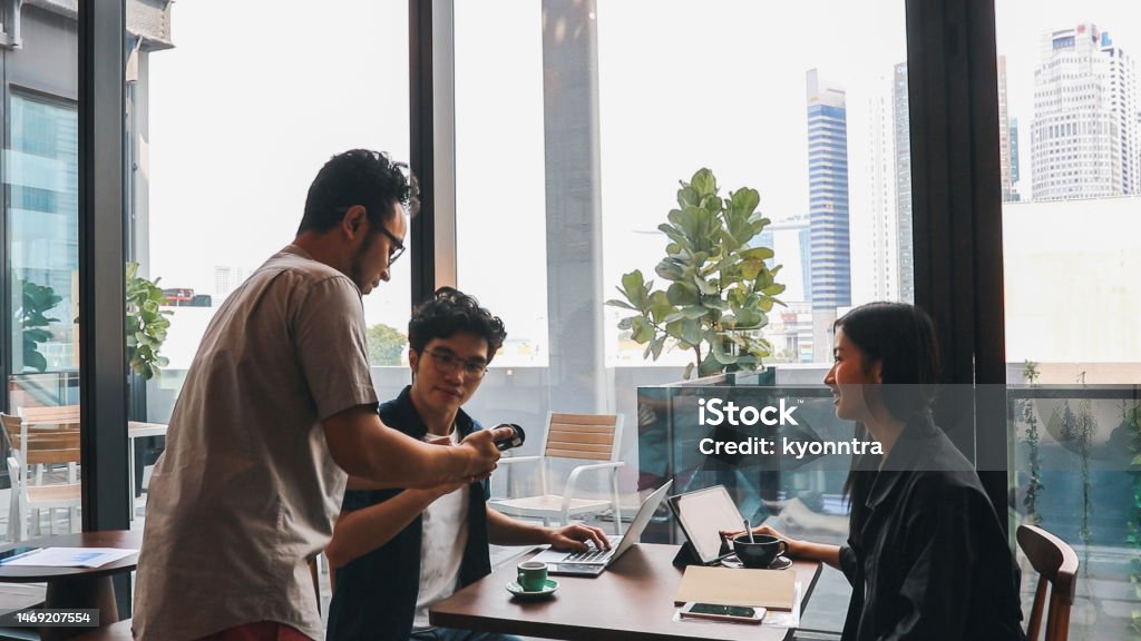 Web Design Team Working on Laptop